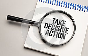 Magnifying glass with the word TAKE DECISIVE ACTION on chart background