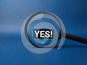 Magnifying glass with the word YES