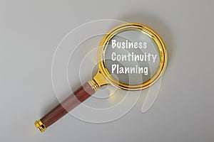 Magnifying glass written with BUSINESS CONTINUITY PLANNING