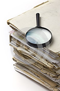 Magnifying lens on the old paper files