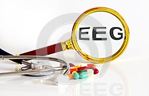 Magnifying lens with text EEG with medical tools