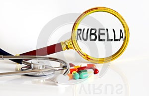 Magnifying lens with text RUBELLA with medical tools