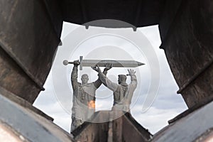 MAGNITOGORSK, RUSSIA - OCTOBER, 2018: Monument Rear-front a large famous sculpture and Eternal flame in granite flower