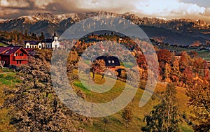 Magura Village in front of Piatra Craiului massif, Brasov, Romania