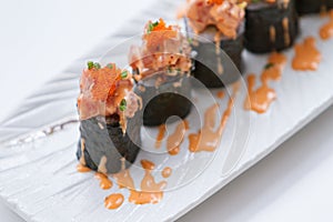 Maguro Maki Sushi Topping with Maguro Bluefin Tuna with Sauce and Ebiko Shrimp Egg Served with Wasabi and Prickled Ginger