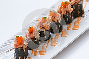 Maguro Maki Sushi Topping with Maguro Bluefin Tuna with Sauce and Ebiko Shrimp Egg Served with Wasabi and Prickled Ginger