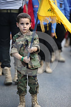 Mahdi Scouts Boys during With flags, pictures and religious slogans during Funeral of Hezbollah