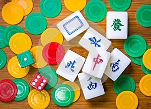 Mahjong, chips and dices on the table