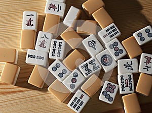 Mahjong tiles on wood table