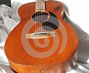 Mahogany Guitar Against A White Background