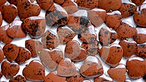 Mahogany obsidian stone hearts are rotating