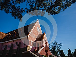 Mai Anh Domaine De Marie Church with vintage windows on brick wall, located in Da Lat, Lam Dong province, Vietnam