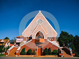 Mai Anh Domaine De Marie Church with vintage windows on brick wall, located in Da Lat, Lam Dong province, Vietnam