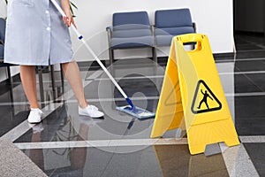 Maid Cleaning The Floor