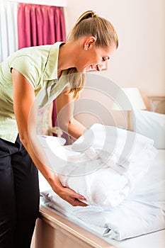 Maid doing room service in hotel