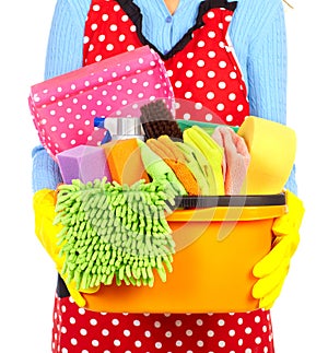 Maid hands with cleaning tools.