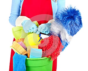 Maid hands with cleaning tools.