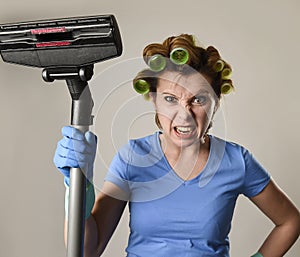 Maid service woman or upset housewife in hair rollers cleaning g