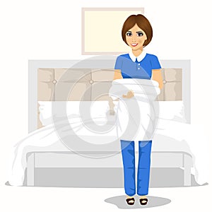 Maid woman with towels and bed sheets. House cleaning service concept