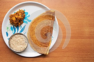 Maida Dosa with Coconut chutney and potato or aloo currey in plate photo