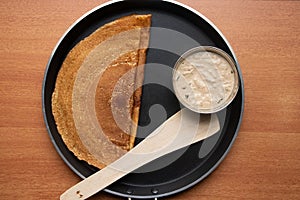 Maida Dosa with Coconut chutneyin tawa, south Indian breakfast photo