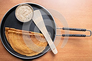 Maida Dosa with Coconut chutneyin tawa, south Indian breakfast photo