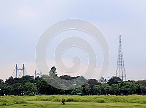 Maidan in kolkata . Howra bridge in the background.