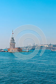 Maiden's Tower aka Kiz Kulesi and cityscape of Istanbul on the background photo