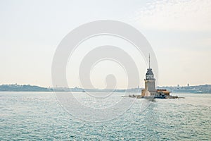 Maiden's Tower or Kiz Kulesi with hazy view of Istanbul