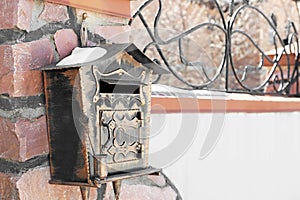 Mail box on fence outdoors