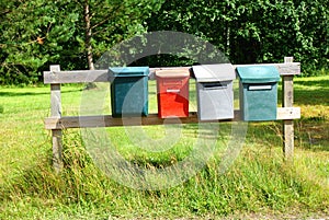 Mail boxes on a wood boards