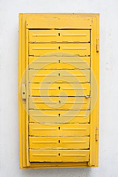 Mail concept old vintage yellow iron letterbox with keyholes on white wall