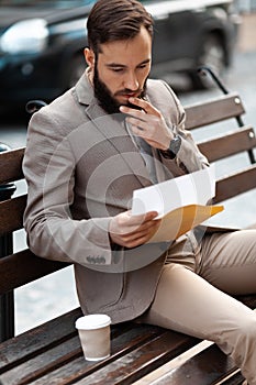 Mail notification. A man reads a letter, a court verdict