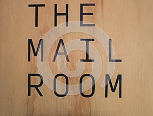 Mail room sign board on the wood background at condominium