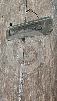 Mailbox in antique wooden door photo