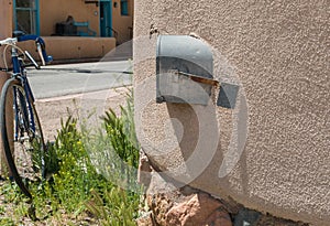 Mailbox is encased in stucco wall