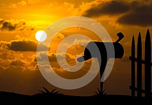 Mailbox silhouette with sunset background