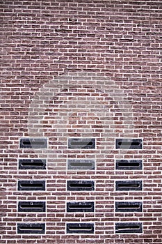 Mailbox slots on a red brick wall an old fashioned building