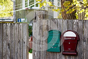 Mailboxes on the fence of a private house in the countryside