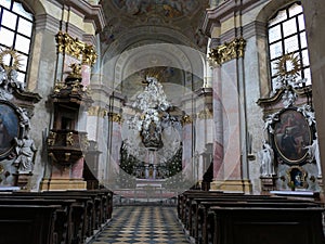 Main baroque altar and rich decorated side altars in Church Of Saint Petar and Paul.