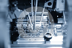 The main board assembly line operation by robotics system control by computer program.