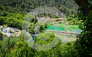 Main boardwalk near waterfalls and park buildings at Krka National Park