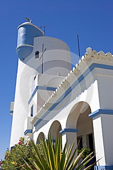 Main boathouse and lookout tower at Duquesa port in Spain