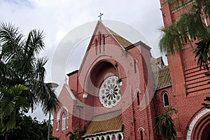 Main building of church with the tree on sky background at cathedral of the holy trinity.