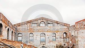 The main building of an old glass factory of the 19th century without a roof, built in the Baroque style in the Siberian outback