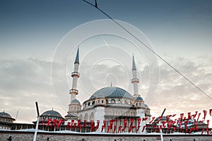 Main building of the Taksim Mosque, also called Taksim camii, with turkish flags.