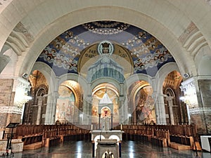 Main centre area of Rosary Lower Basilica of Sanctuary of Our Lady of Lourdes with Mosaic depicting the Virgin Mary