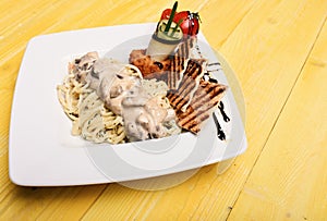 Main course concept. Pasta with white sauce and decor