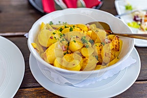 Main dish a fish pan with  potatoes