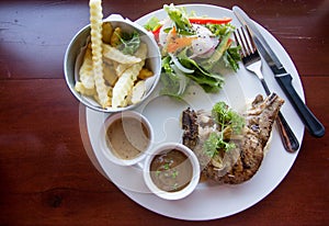 The main dish is the pork chop Were placed on a table ready to be served.